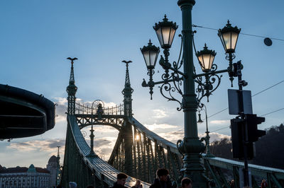 Low angle view of street light against buildings