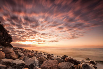 Scenic view of sea against dramatic sky