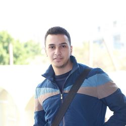 Portrait of young man standing outdoors