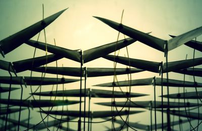 Low angle view of metal structure against sky