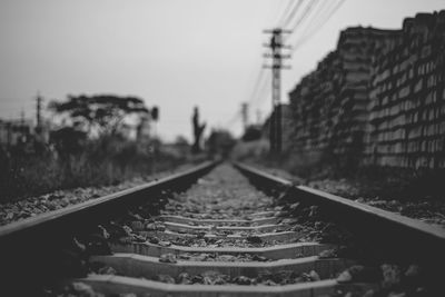 Surface level of railroad tracks against sky