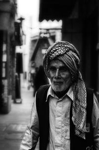 Senior man turban while standing on street