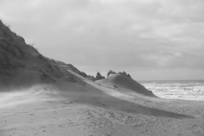 Scenic view of beach against sky