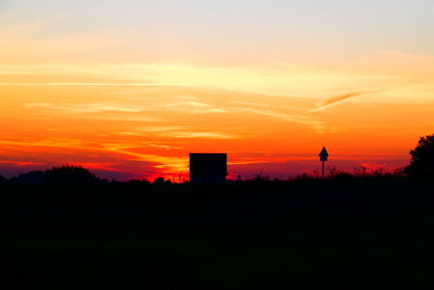 Scenic view of silhouette landscape against sky during sunset