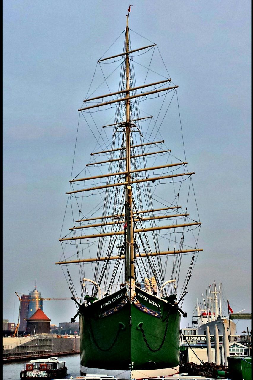 nautical vessel, mast, sky, no people, outdoors, architecture, built structure, transportation, day, harbor, building exterior, moored, clear sky, tall ship