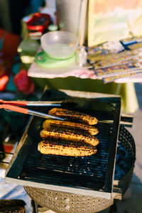 High angle view of meat on barbecue grill