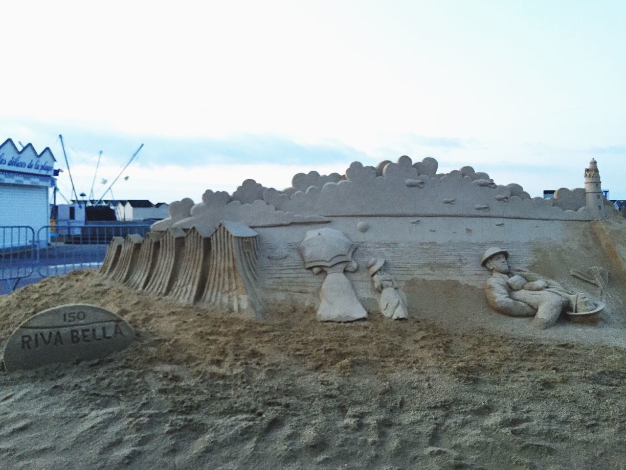 sky, architecture, built structure, clear sky, building exterior, art and craft, day, copy space, art, old, outdoors, no people, history, creativity, abandoned, damaged, sand, nature, beach, wall - building feature