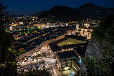 High angle view of illuminated buildings in city