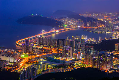 High angle view of illuminated city buildings at night