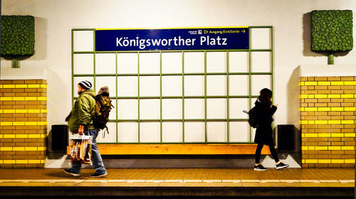 People walking on railroad station