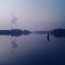 Scenic view of calm lake at sunset