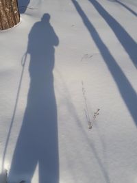 High angle view of man shadow on floor
