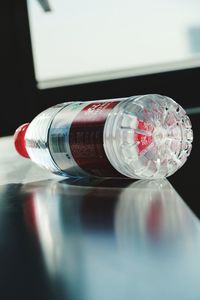 Close-up of glass bottle on table