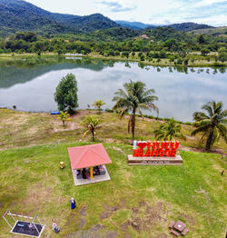 High angle view of lake and trees on field