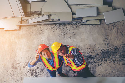 High angle portrait of workers at construction site