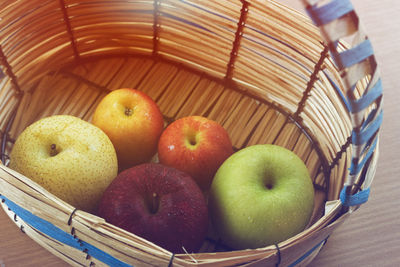 Close-up of fruits in basket on table