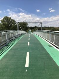 View of empty road against cloudy sky