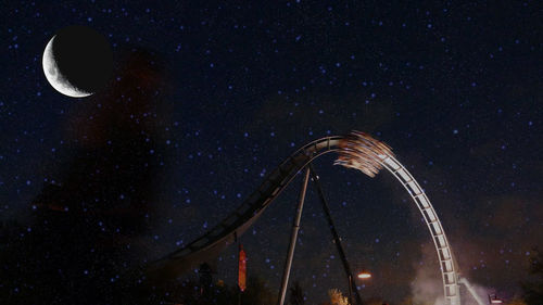 Low angle view of light against sky at night