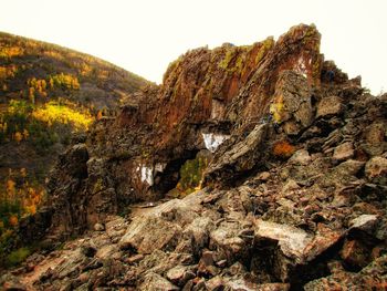 Rock formation on mountain against sky