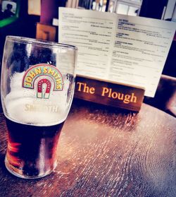 Close-up of beer glass on table