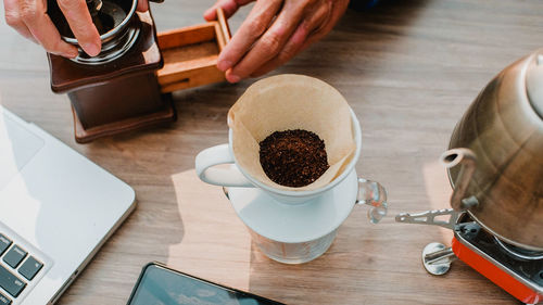  roasted coffee in paper filter for make drip coffee in morning, drip brewing coffee concept.