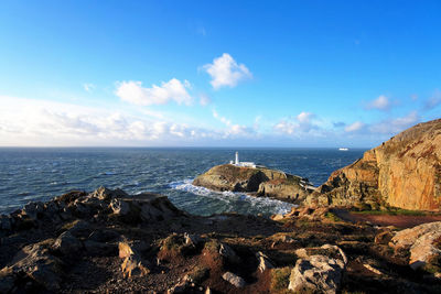 Panoramic view of sea against blue sky