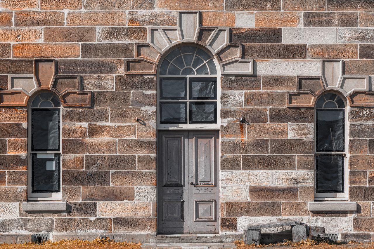 architecture, built structure, building exterior, window, wall, building, day, brick, no people, brick wall, wall - building feature, outdoors, entrance, old, arch, door, closed, protection, security, residential district