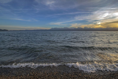 Scenic view of lake against sky during sunset