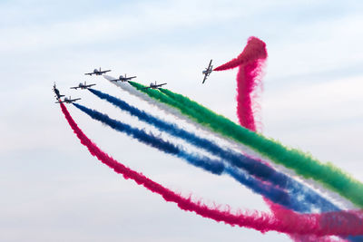 Al fursan aerobatic team doing stunts in the sky in abu dhabi, uae