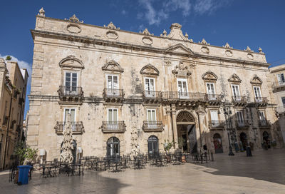 Historic buildings with beautiful facades in piazza duomo in ortigia