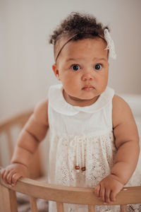 Portrait of cute baby at home