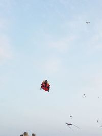 Low angle view of kite flying in sky