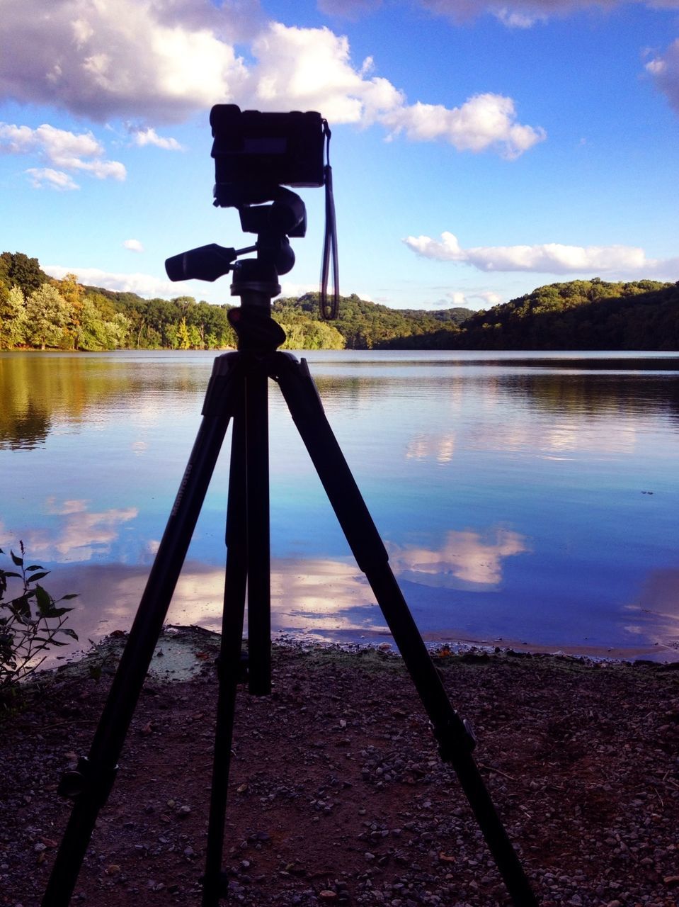 water, sky, tranquility, lake, tranquil scene, cloud - sky, reflection, scenics, nature, cloud, beauty in nature, sunset, outdoors, idyllic, no people, pole, calm, silhouette, tree, metal