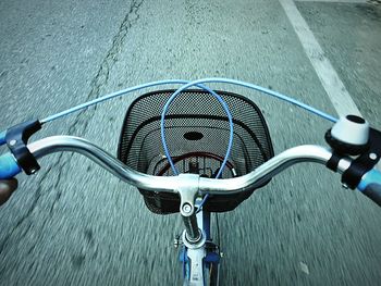 Close-up of bicycle parked on road