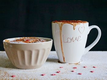 Close-up of coffee cup on table