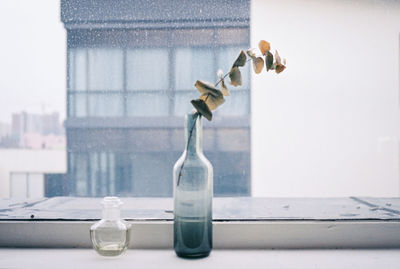 Close-up of glass bottle on table