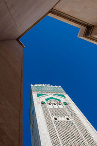 Low angle view of buildings against blue sky