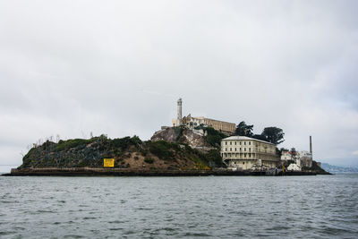 Alcatraz by sea against sky
