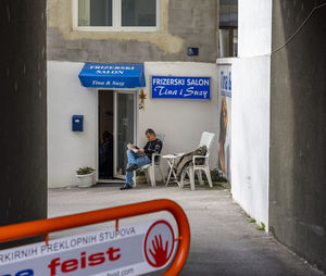 Man with text on parking sign