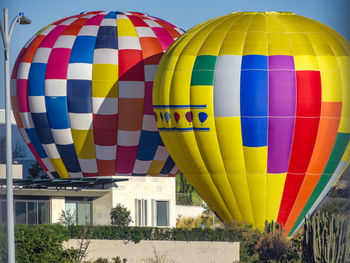 Colorful hot air balloons in city