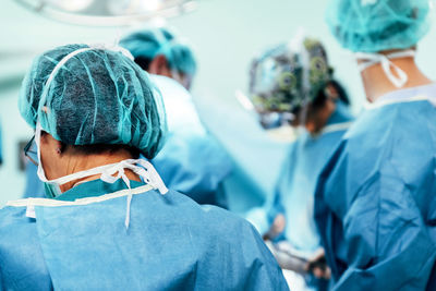 Surgeons working in operating room