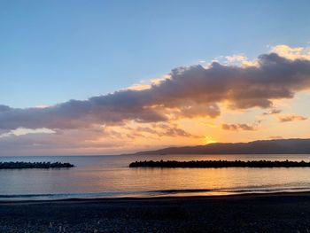 Scenic view of sea against sky during sunset