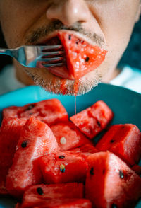 Man eating watermelon