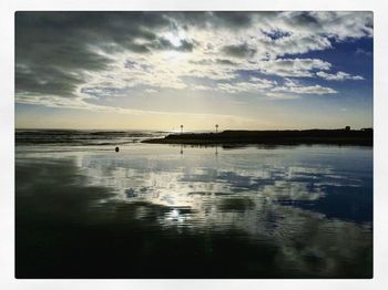 Scenic view of sea against sky at sunset