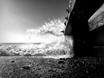 View of built structure by sea