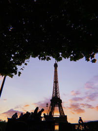 Low angle view of tower against cloudy sky