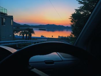 Scenic view of sunset seen through car windshield