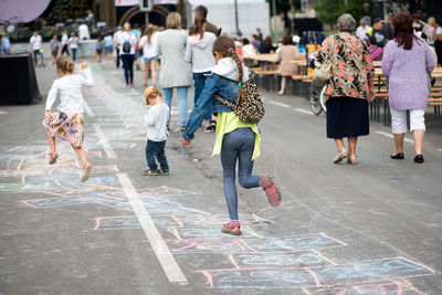 People walking on street in city