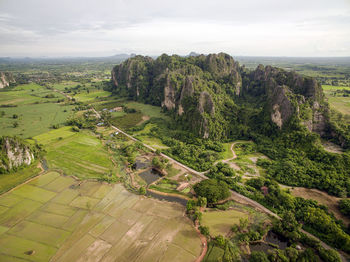 Scenic view of agricultural landscape against sky