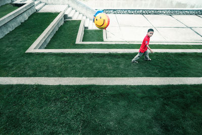 Full length of a boy with ball